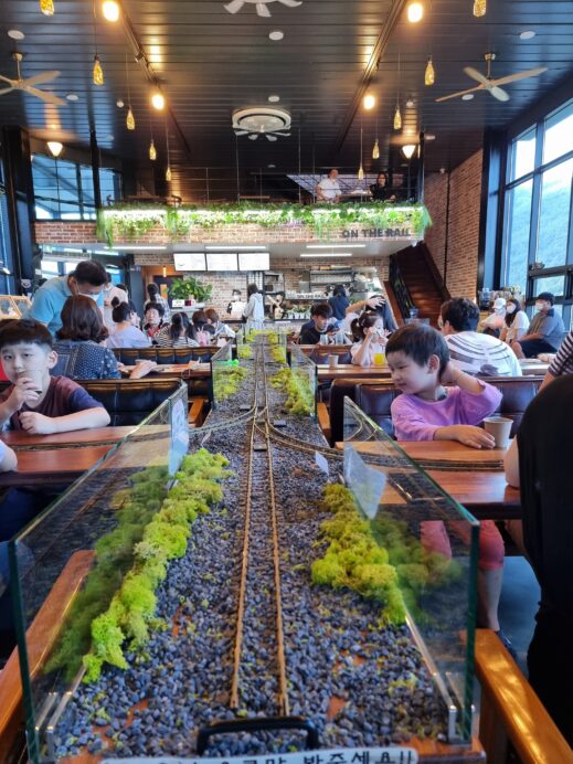 On-the-Rails-center-track-with-kids-519x692 The Best Guide to Cafes in Gachang South Korea