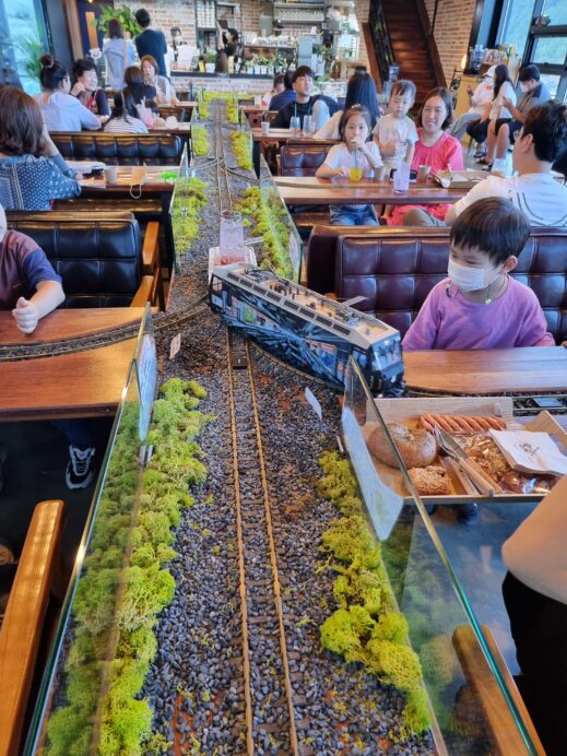 On-the-Rails-closeup-center-track-with-kids-519x692 The Best Guide to Cafes in Gachang South Korea